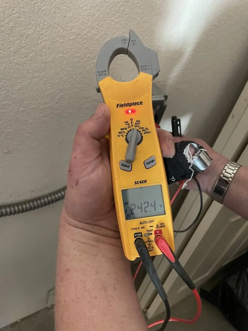Voltage testing with clamp meter during Outlet Installation in Rockland